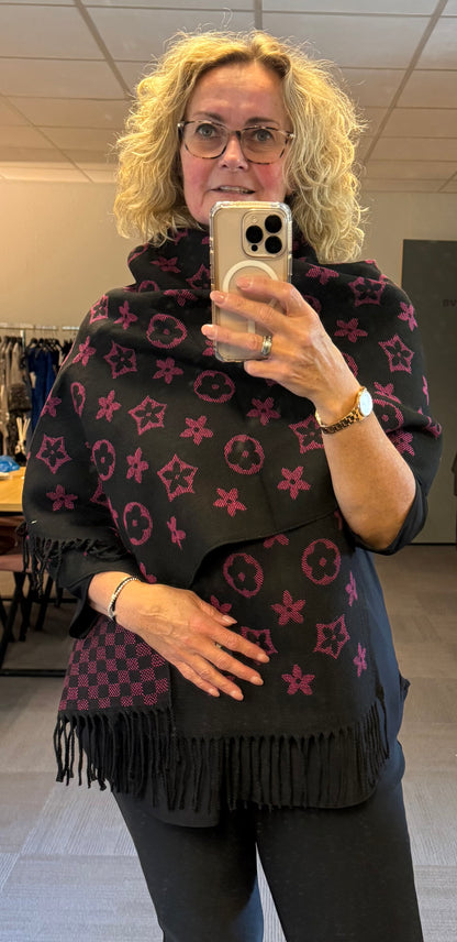 Lange viscose sjaal die je aan 2 kanten kunt dragen.